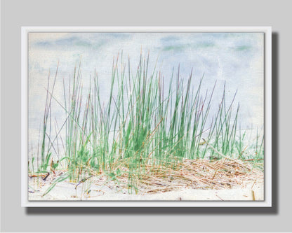 A photo of a patch of tall, green grass on a beach. Printed on canvas in a float frame.