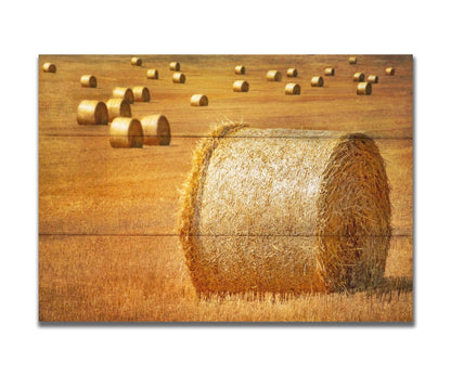 A photo of a field of freshly harvested and baled hay. Printed on a box board.