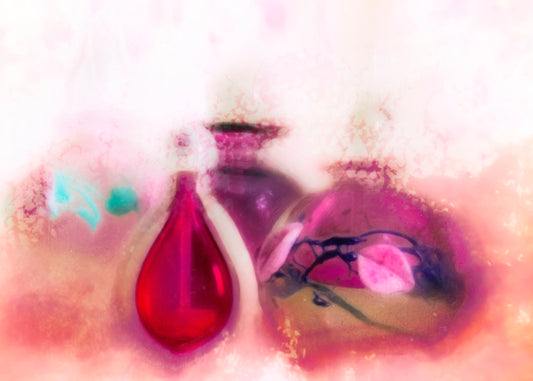 An edited photo of an assortment of pink perfume bottles, edited to be reminiscent of watercolor. 