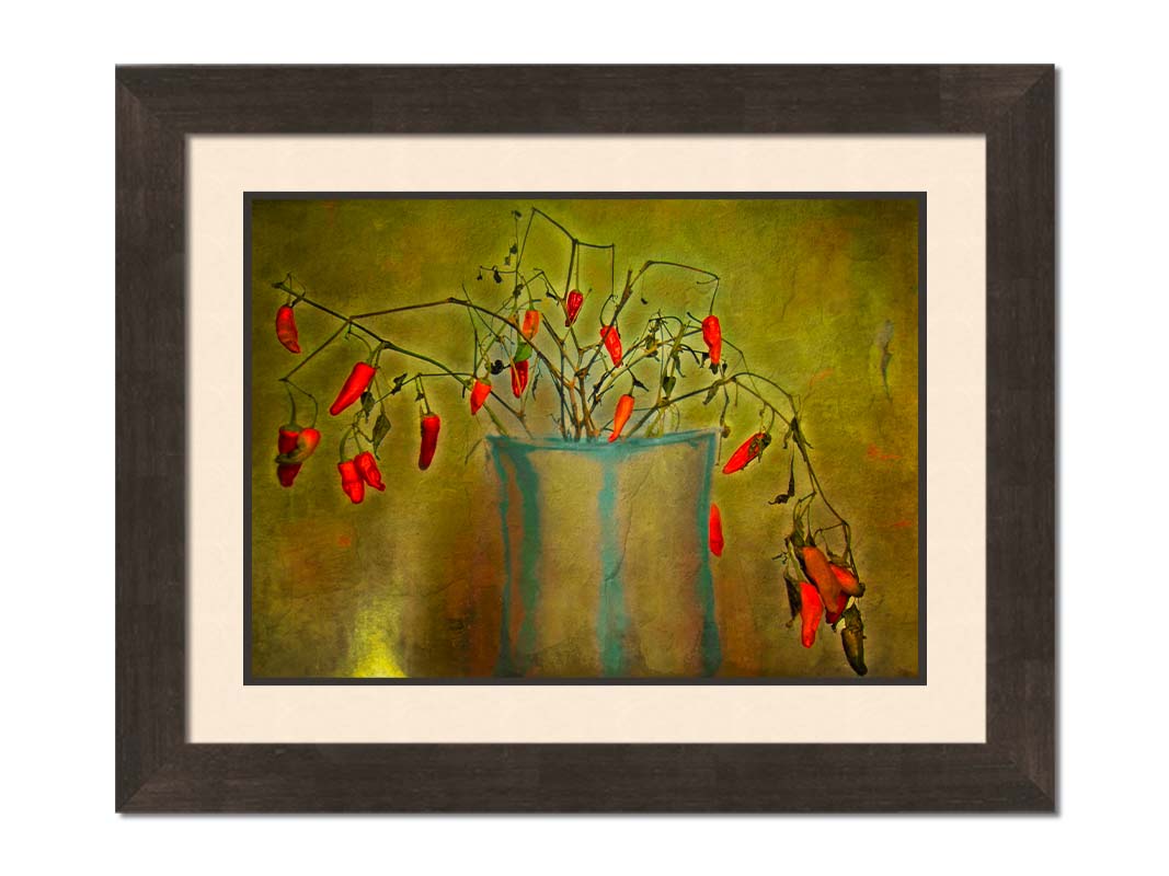 A photo of a pepper plant growing from a white and blue vase, edited with textures to add weathering. Printed on paper, matted, and framed.