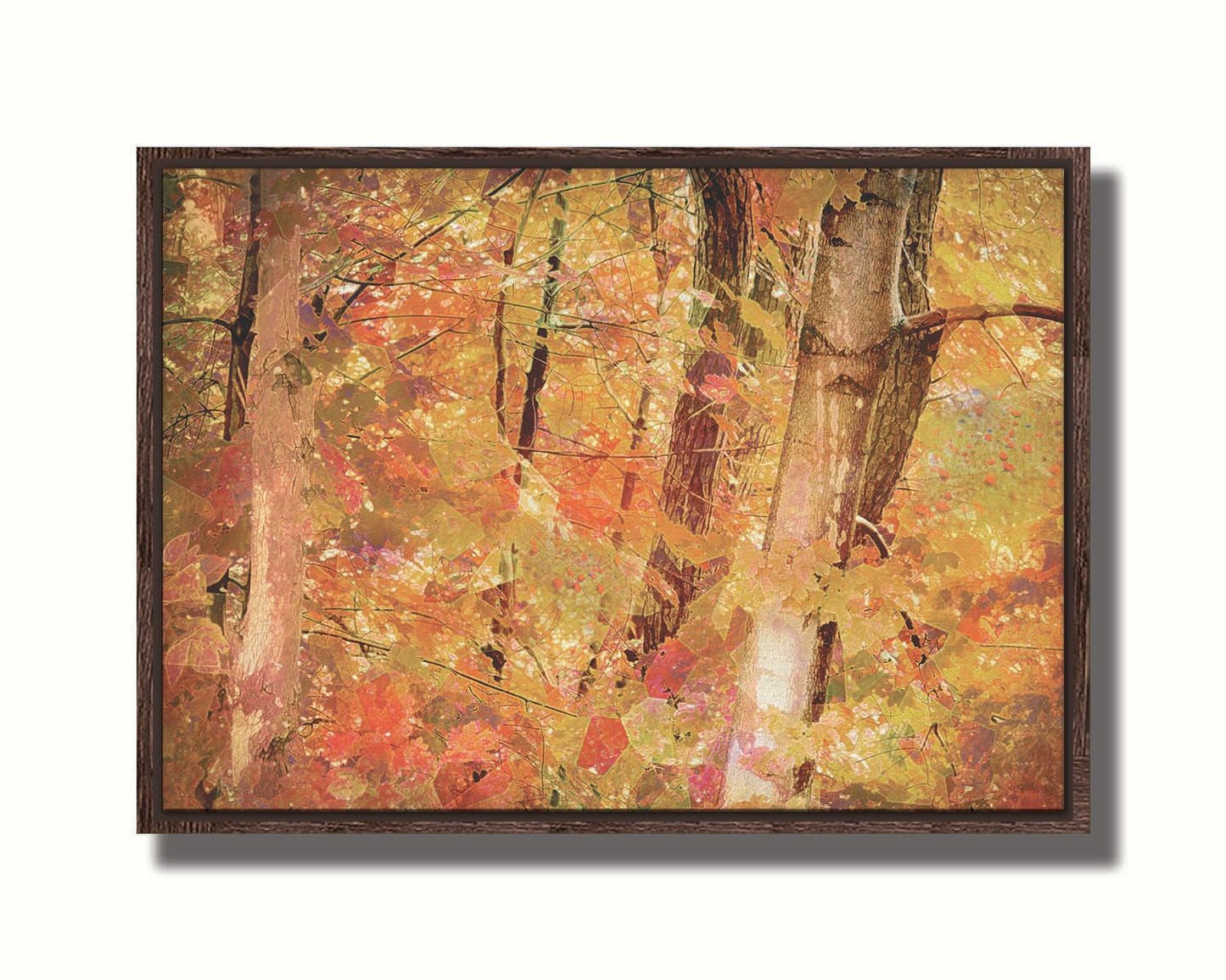 A photo of a forest of trees in fall, edited with a very graphic art style. Printed on canvas in a float frame.