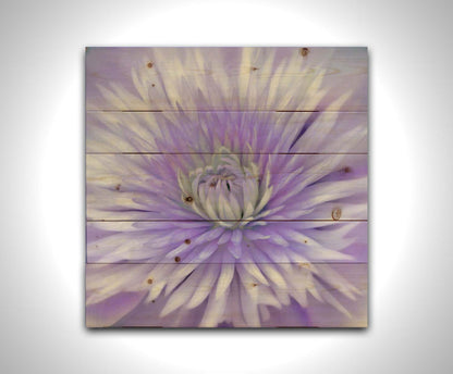 A close-up photo of a clematis flower in purple. Printed on a wood pallet.