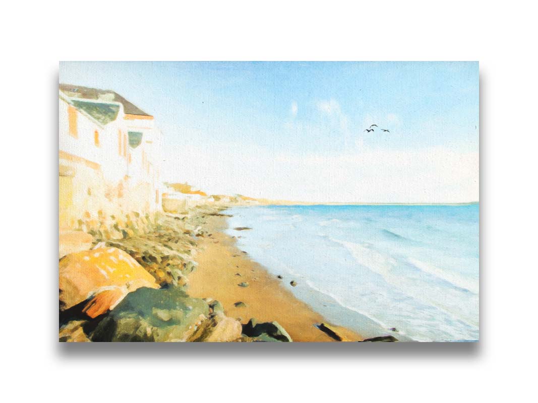 A photo of a beach lined with houses on a calm, sunny day.  Printed on canvas.