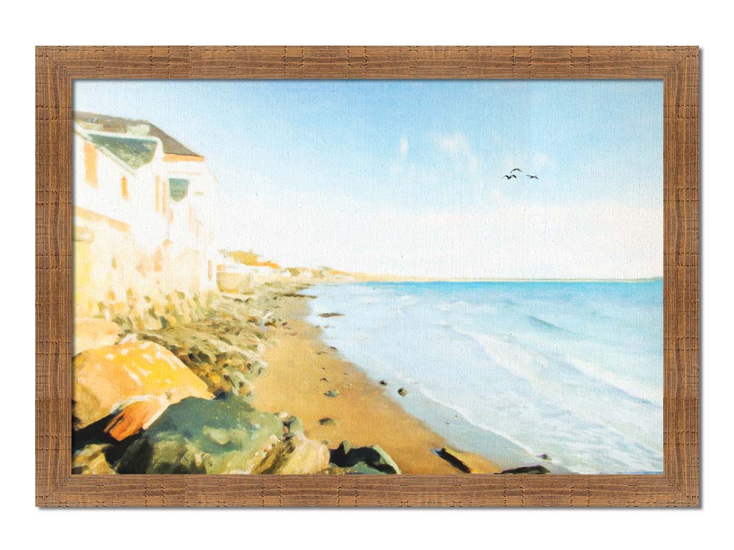 A photo of a beach lined with houses on a calm, sunny day.  Printed on canvas and framed.