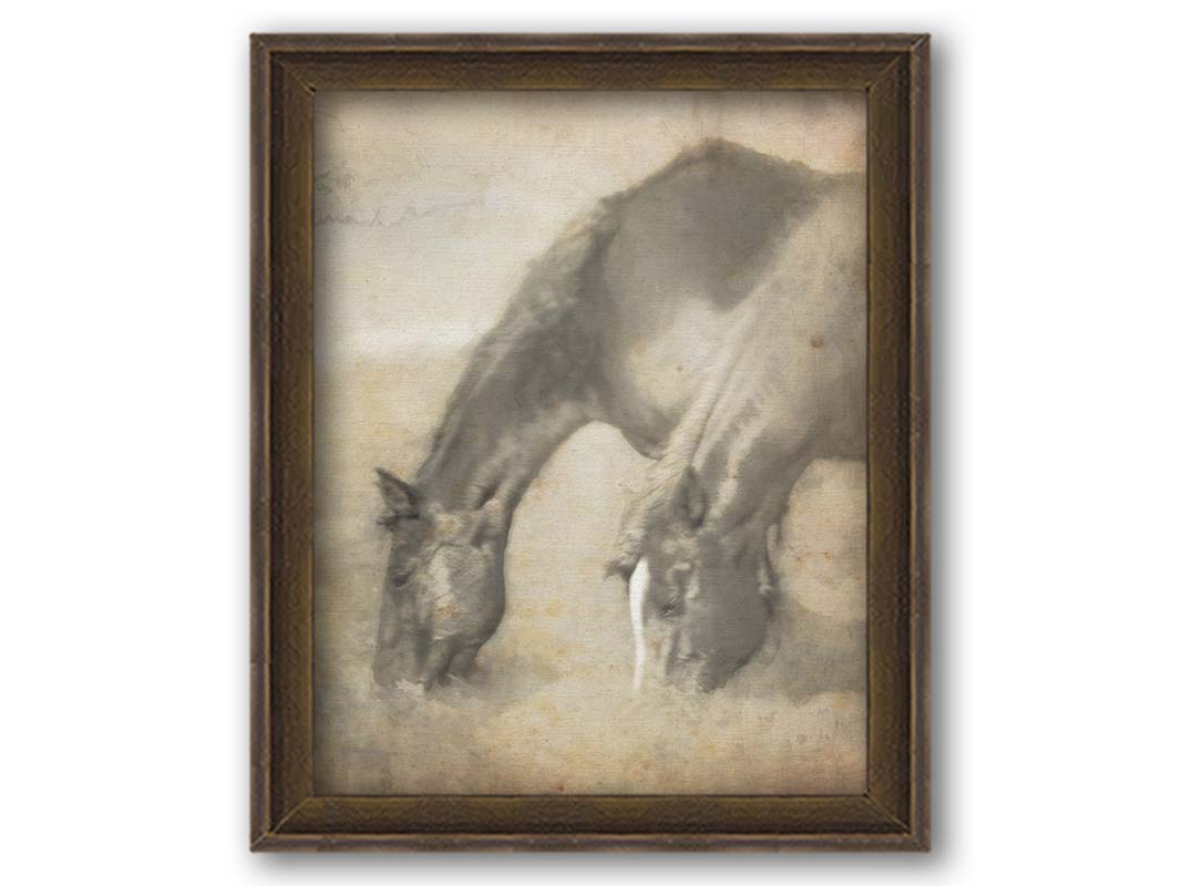 A sepia photo of two horses grazing, overlayed with weathered and stained textures. Printed on canvas and framed.