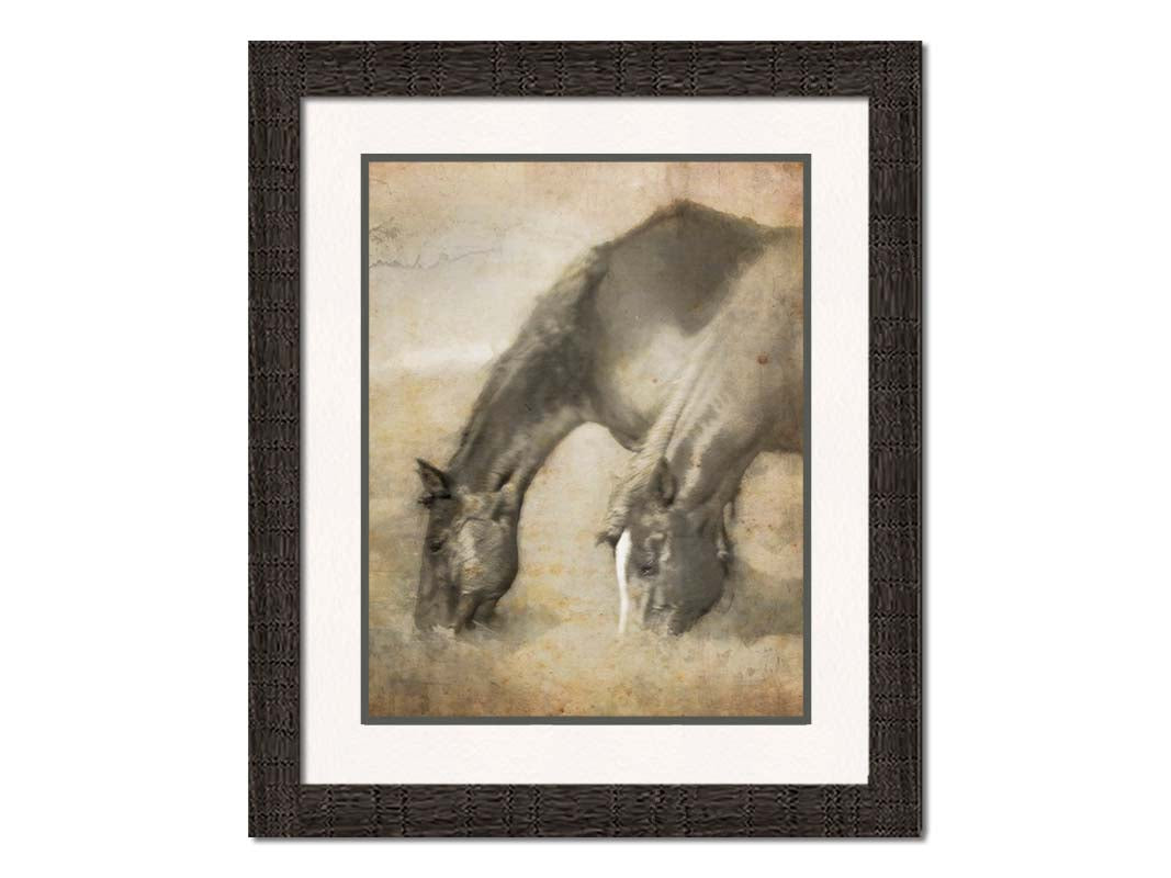 A sepia photo of two horses grazing, overlayed with weathered and stained textures. Printed on paper, matted, and framed.