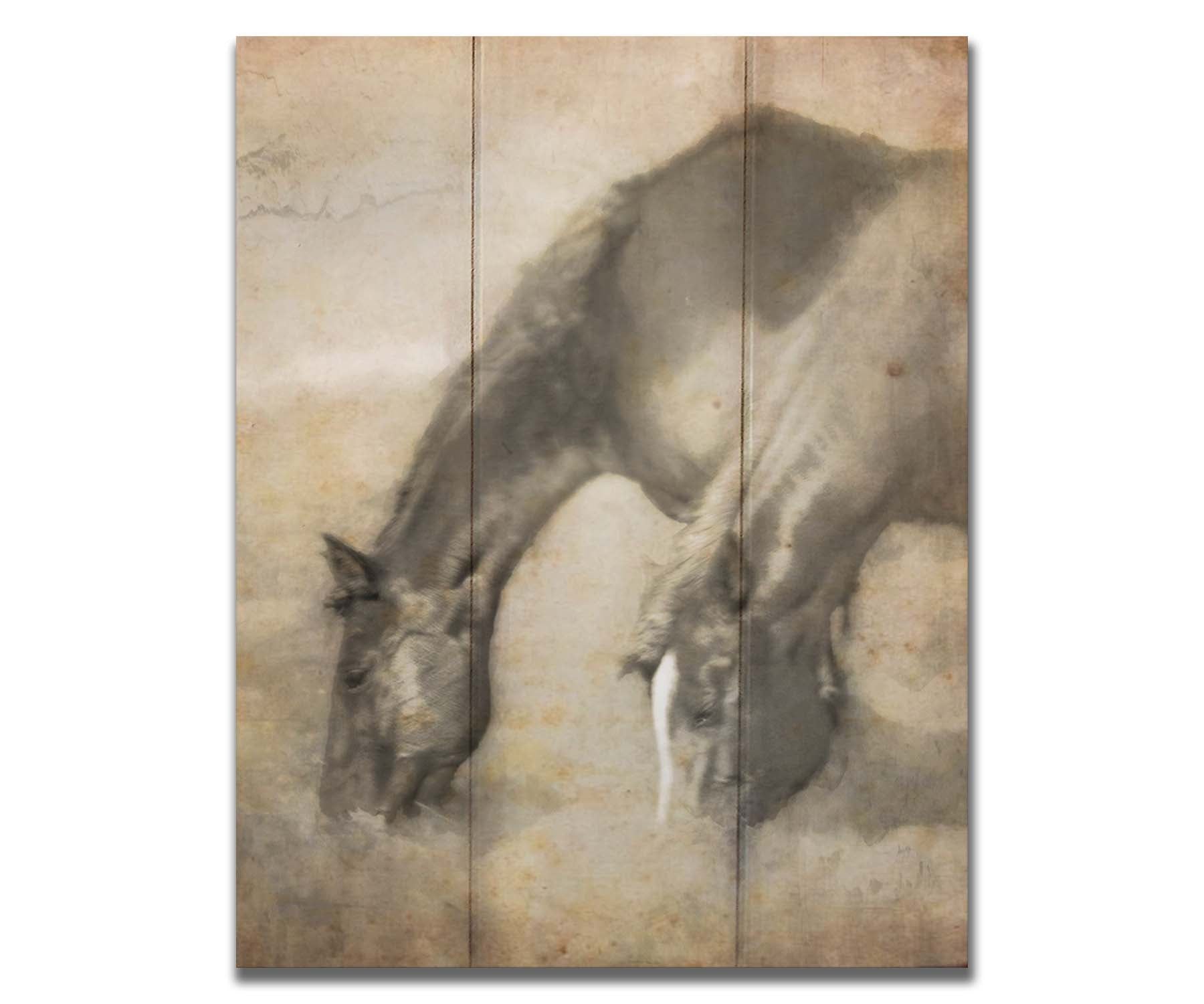 A sepia photo of two horses grazing, overlayed with weathered and stained textures. Printed on a box board.