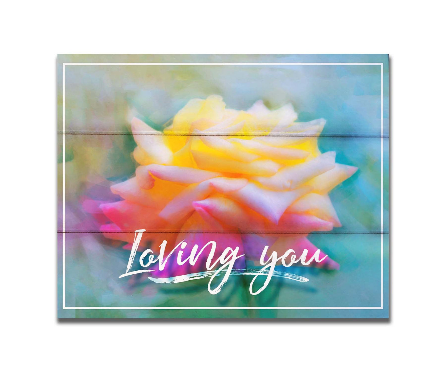 A photo of a pink and yellow rose against a blue background, edited to have a painterly appearance. It is overlaid with a white border and text reading "Loving you." Printed on a box board.