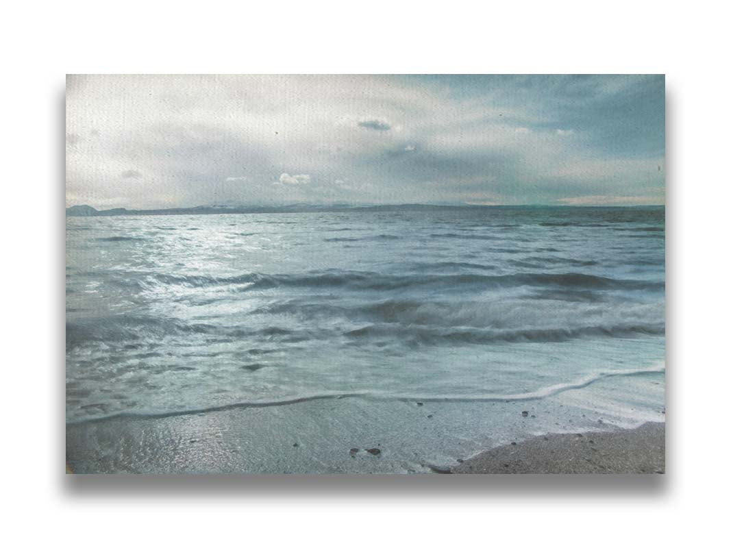 A photo of the sea on a cloudy day, creating a desaturated, stormy look. Printed on canvas.