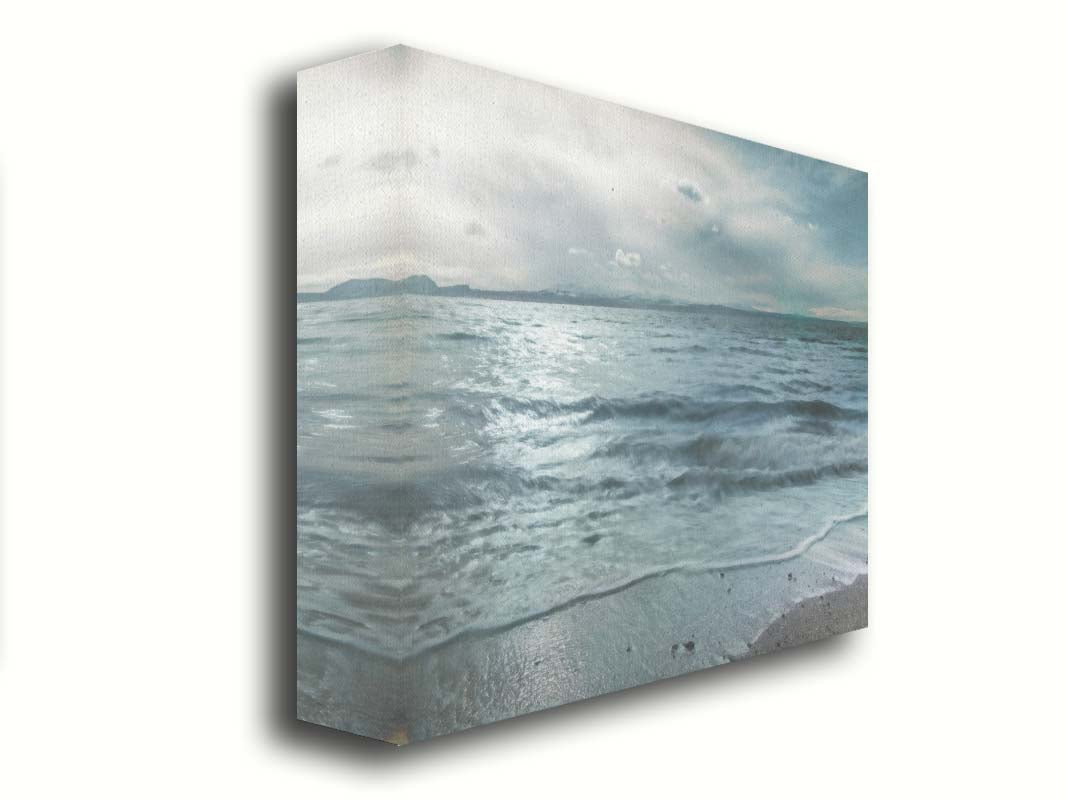 A photo of the sea on a cloudy day, creating a desaturated, stormy look. Printed on canvas.