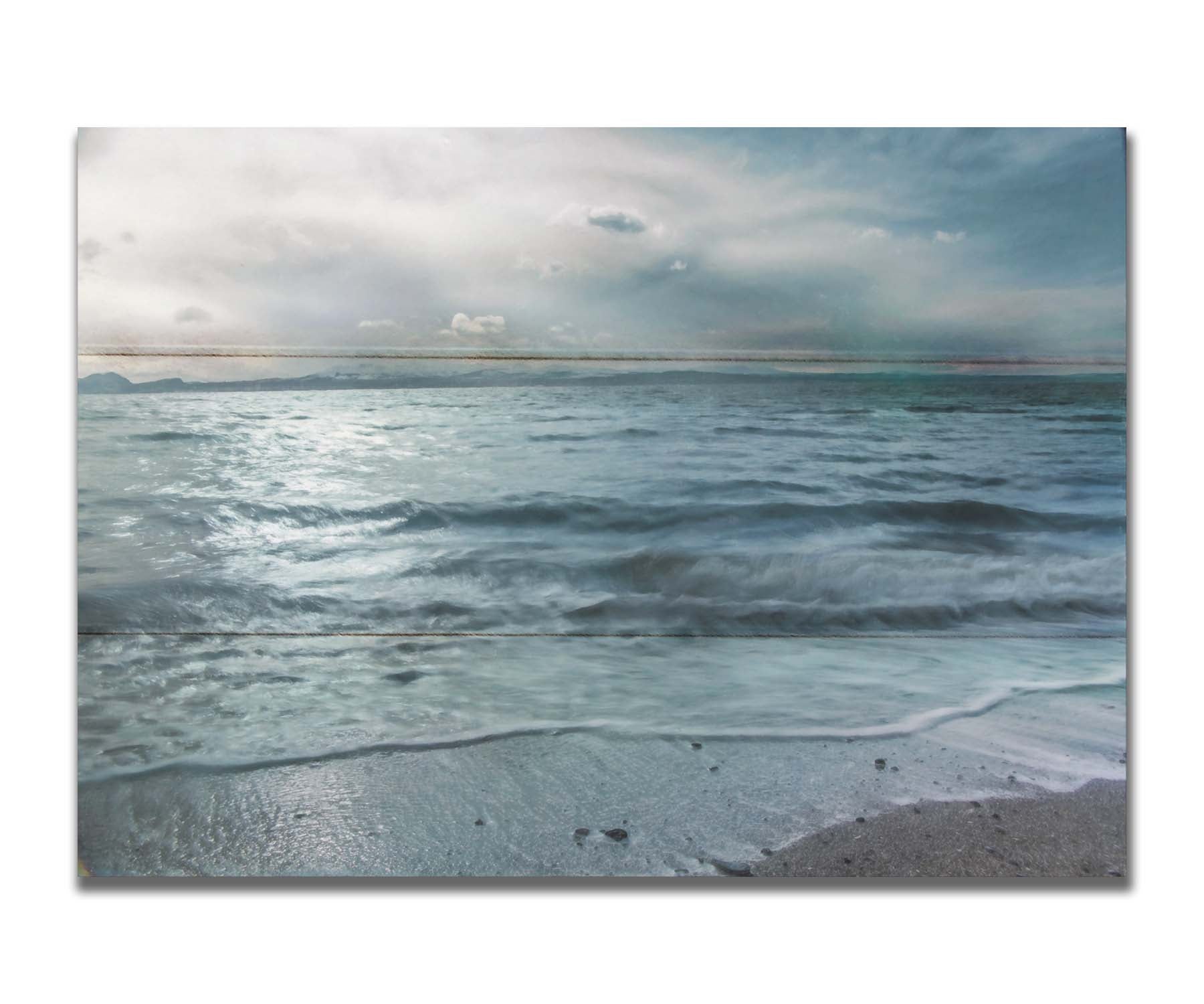 A photo of the sea on a cloudy day, creating a desaturated, stormy look. Printed on a box board.