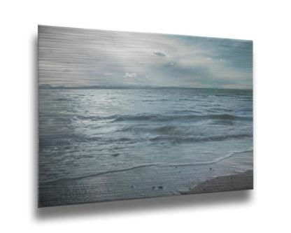 A photo of the sea on a cloudy day, creating a desaturated, stormy look. Printed on metal.