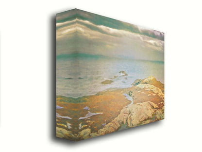 A photo of a stoney shore, looking out to sea under a cloudy sky. Printed on canvas.