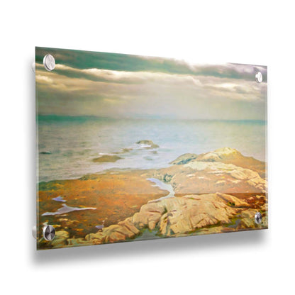 A photo of a stoney shore, looking out to sea under a cloudy sky. Printed on acrylic.