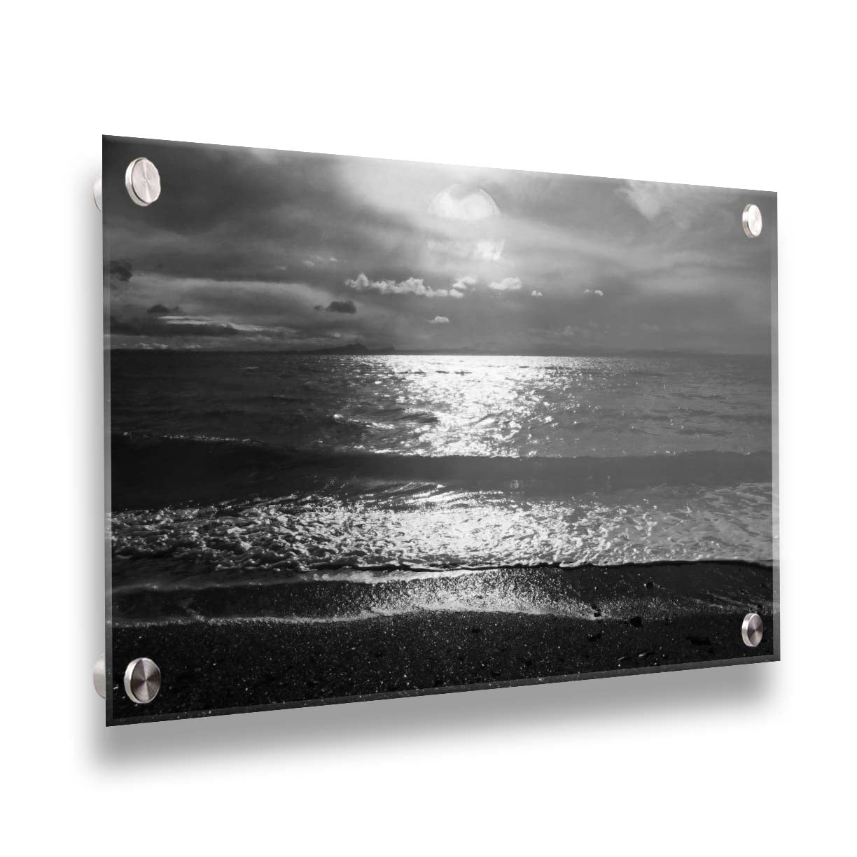 A photograph of the sea at night in grayscale. The light from the moon rerflects off the water in sharp contrast through the darkness of night. Printed on acrylic.