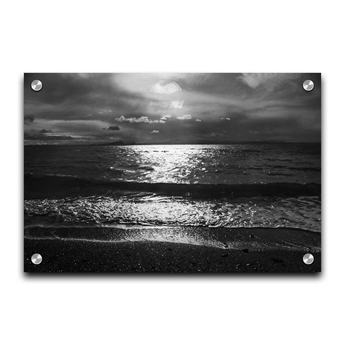 A photograph of the sea at night in grayscale. The light from the moon rerflects off the water in sharp contrast through the darkness of night. Printed on acrylic.