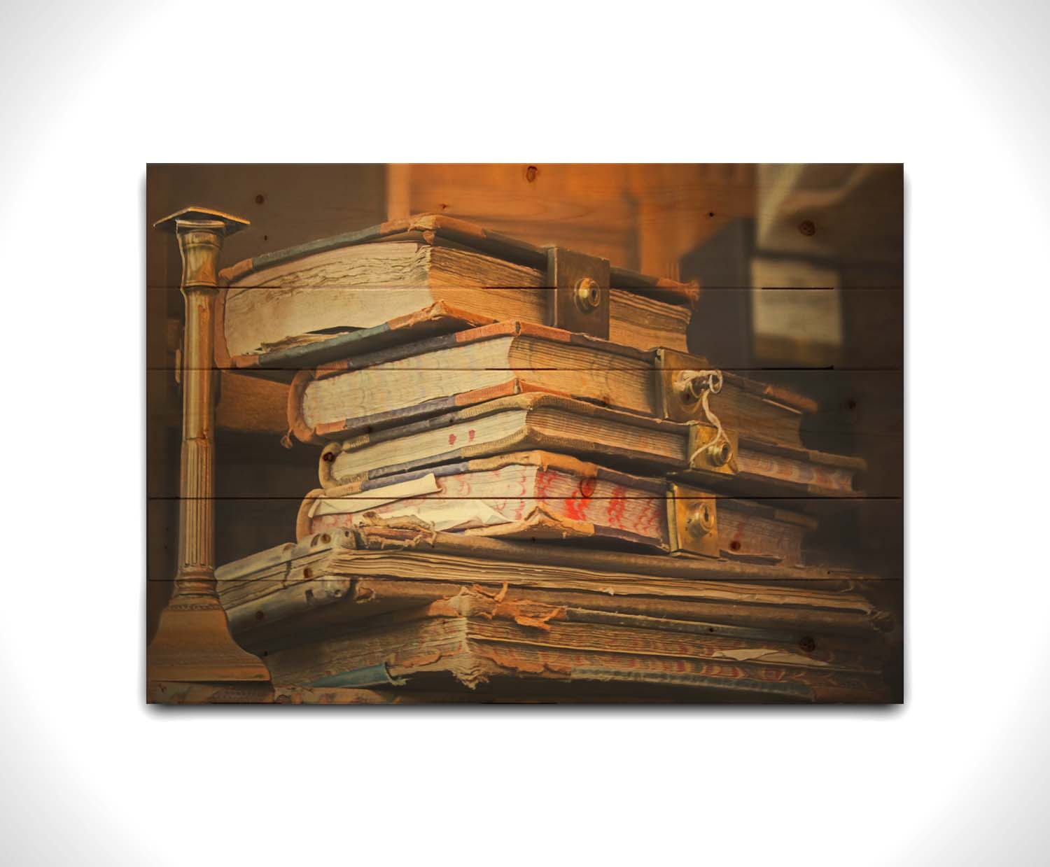 A photo of a stack of worn books, many bound shut by brassy locks. Printed on a wood pallet.