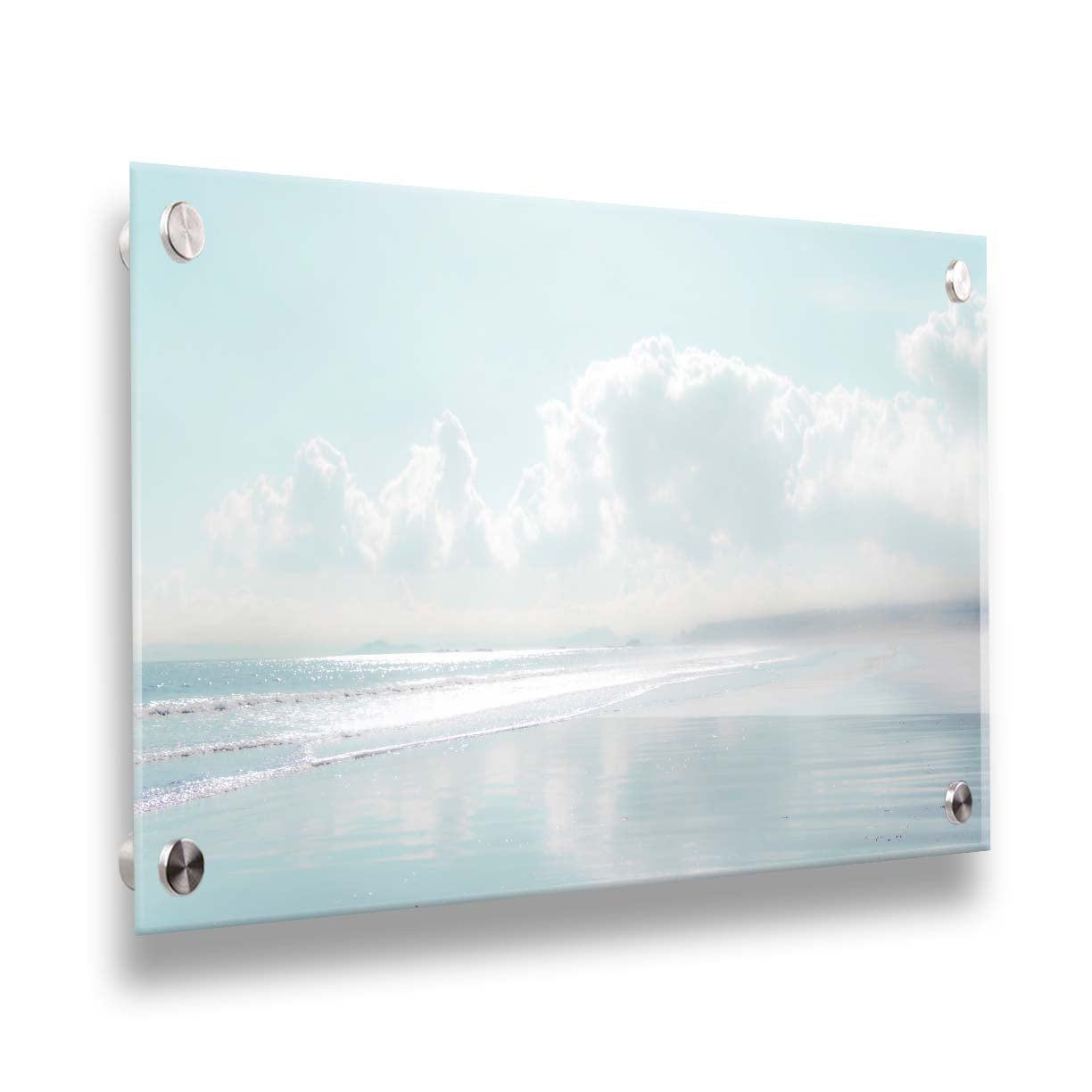 A photo of a beach on a bright but foggy day. The light reflects on the wet sand with the color of the sky,, adding to the dreamlike appearance. A city can be seen through the fog in the distance. Printed on acrylic.