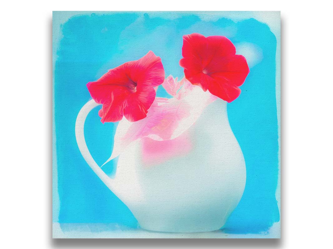 A photo of two red flowes in a white pitcher vase against a cyan backgrround. Printed on canvas.