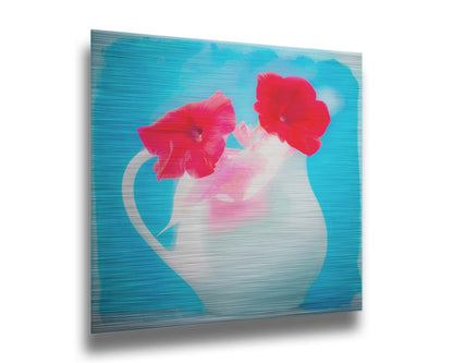 A photo of two red flowes in a white pitcher vase against a cyan backgrround. Printed on metal.