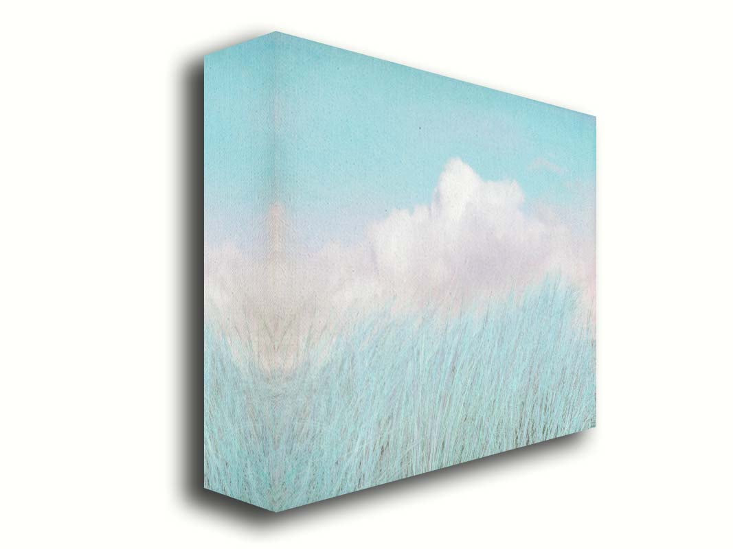 A photo of tall grass under a blue sky with white clouds. Printed on canvas.