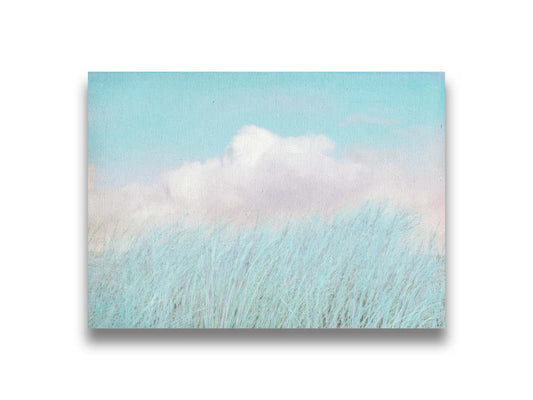 A photo of tall grass under a blue sky with white clouds. Printed on canvas.