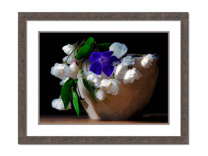 A photo of a brown bowl of white and purple flowers, edited to have a painterly quality. Printed on paper, matted, and framed.