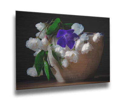 A photo of a brown bowl of white and purple flowers, edited to have a painterly quality. Printed on metal.