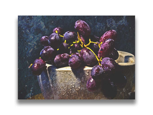 A photo of a bunch of purple grapes in a bowl, covered in drops of water and overlayed with textues. Printed on canvas.