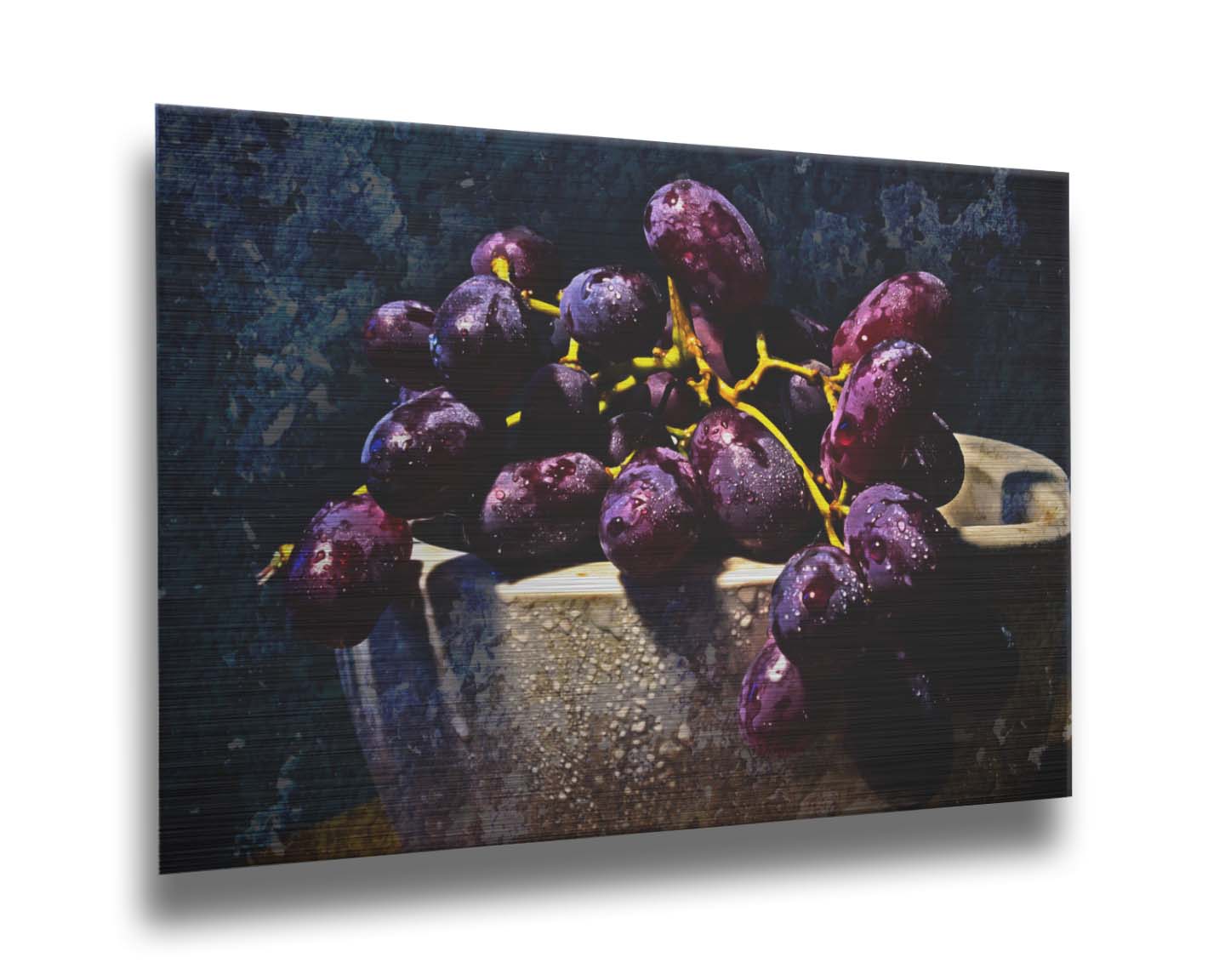 A photo of a bunch of purple grapes in a bowl, covered in drops of water and overlayed with textues. Printed on metal.