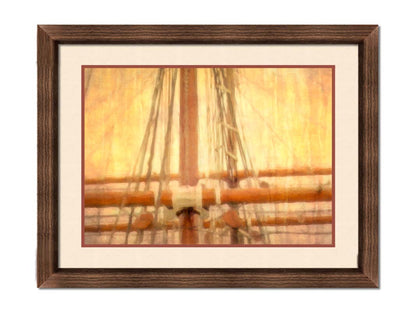 A photo of a ship's rigging against a yellow and orange sky. Printed on paper, matted, and framed.