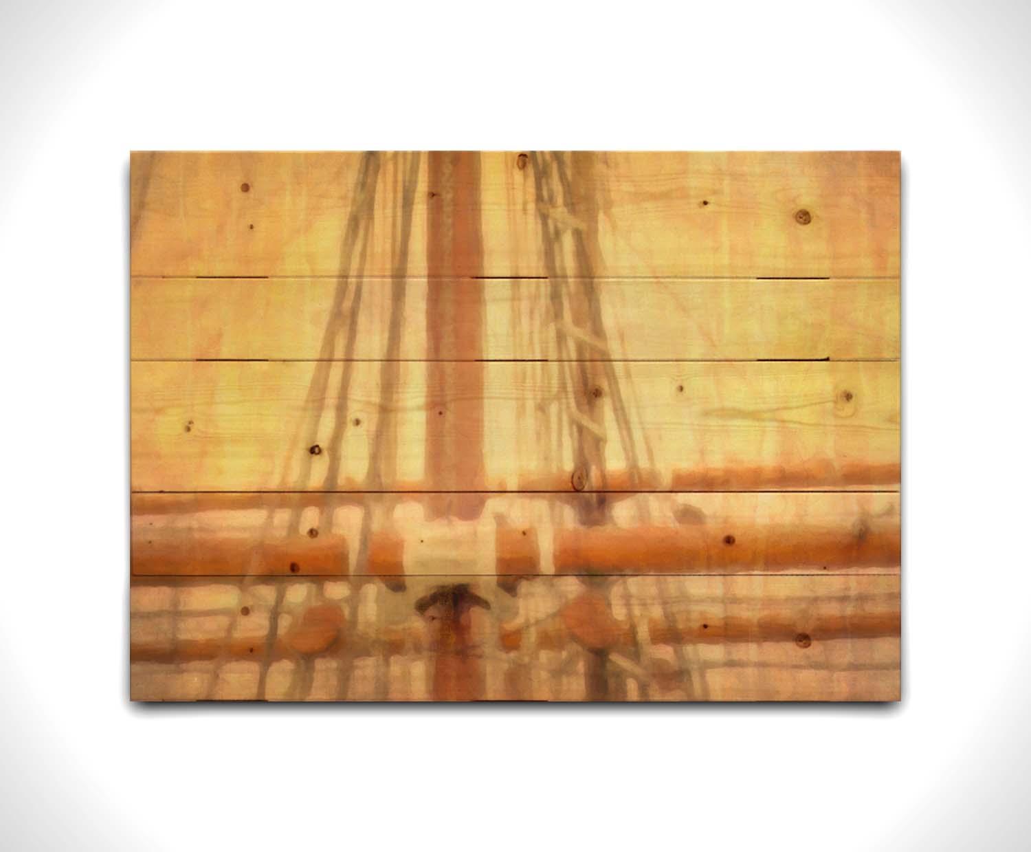 A photo of a ship's rigging against a yellow and orange sky. Printed on a wood pallet.