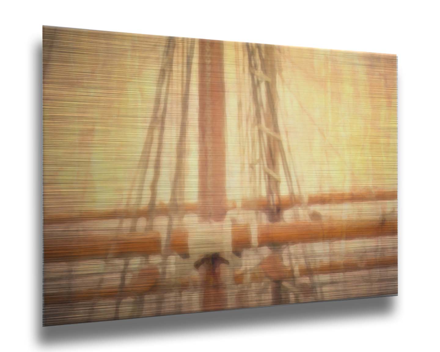 A photo of a ship's rigging against a yellow and orange sky. Printed on metal.