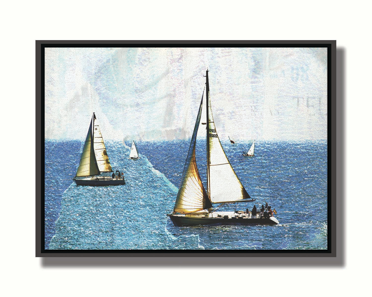 A photo of several sail boats at sea, edited to be rough and paper-textured with some unclear text in the backgrond. Printed on canvas in a float frame.