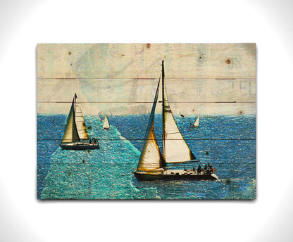 A photo of several sail boats at sea, edited to be rough and paper-textured with some unclear text in the backgrond. Printed on a wood pallet.