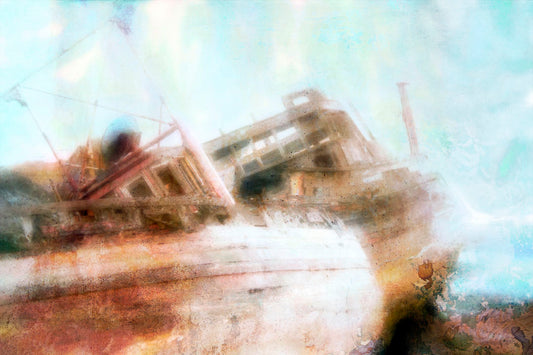 A photo of an old, shipwrecked boat on the beach.