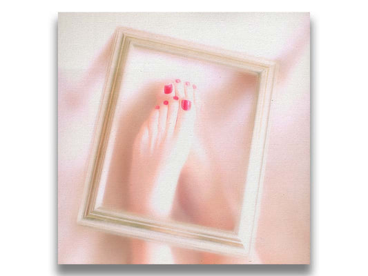 A photo of feet with red painted nails, with a photo frame resting on top. Printed on canvas.