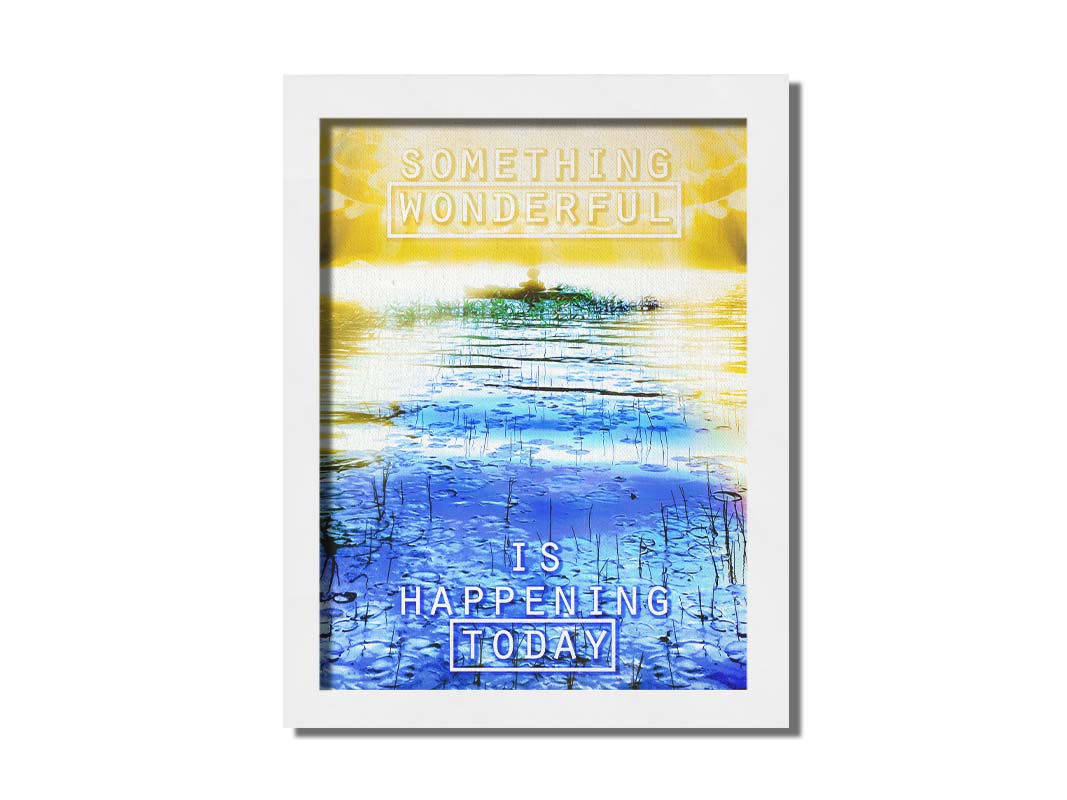 An edited photo graphic depicting a person in a canoe on a lake. It is bathed in yellow light, contrasted by the bright blue water. It is overlaid with the phrase "Something wonderful is happening today." Printed on canvas and framed.