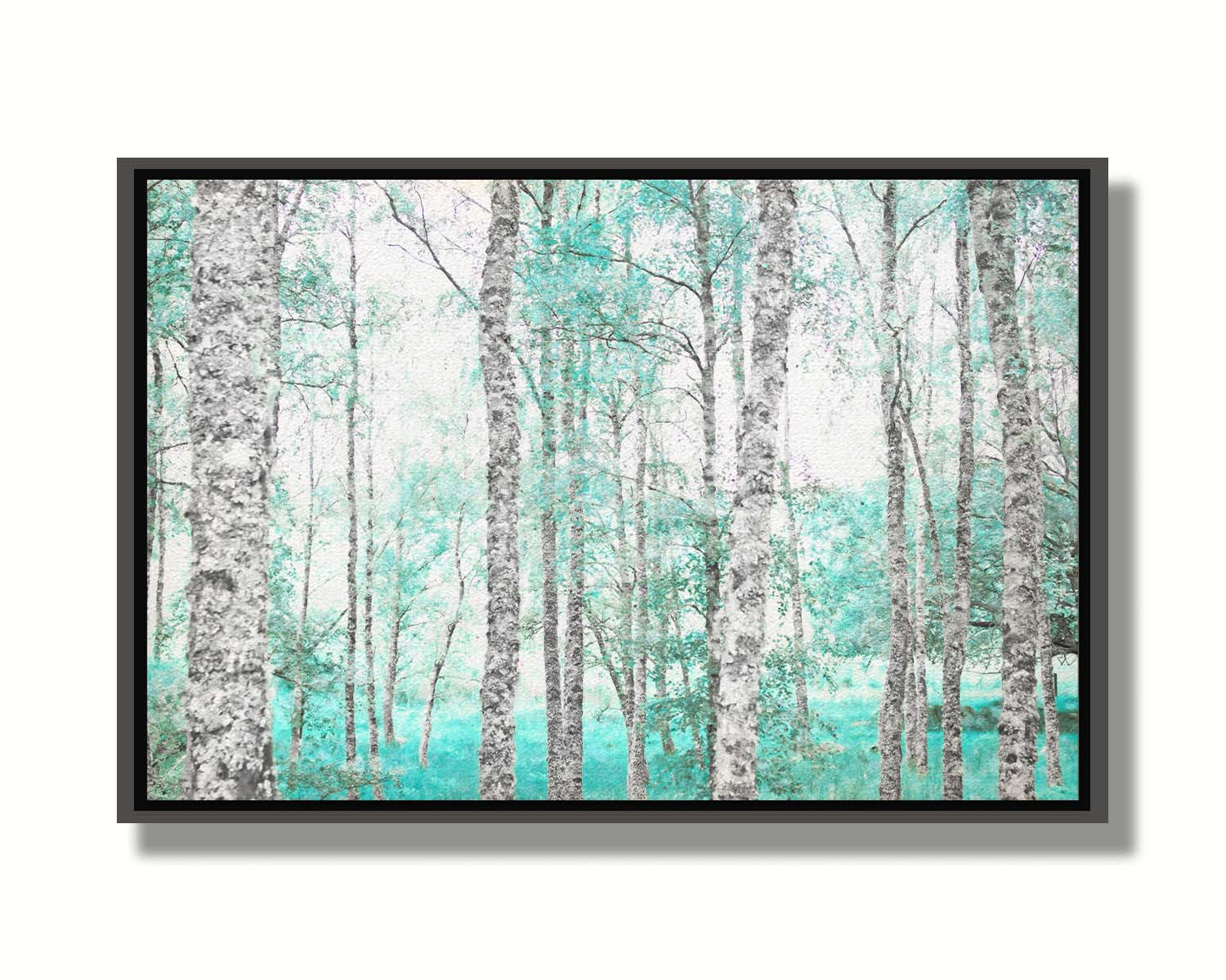 A photograph of a forest of rough trees, edited in grayscale with selective areas of vibrant blue teal on the leaves and grass. Printed on canvas in a float frame.