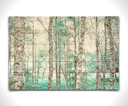 A photograph of a forest of rough trees, edited in grayscale with selective areas of vibrant blue teal on the leaves and grass. Printed on a wood pallet.