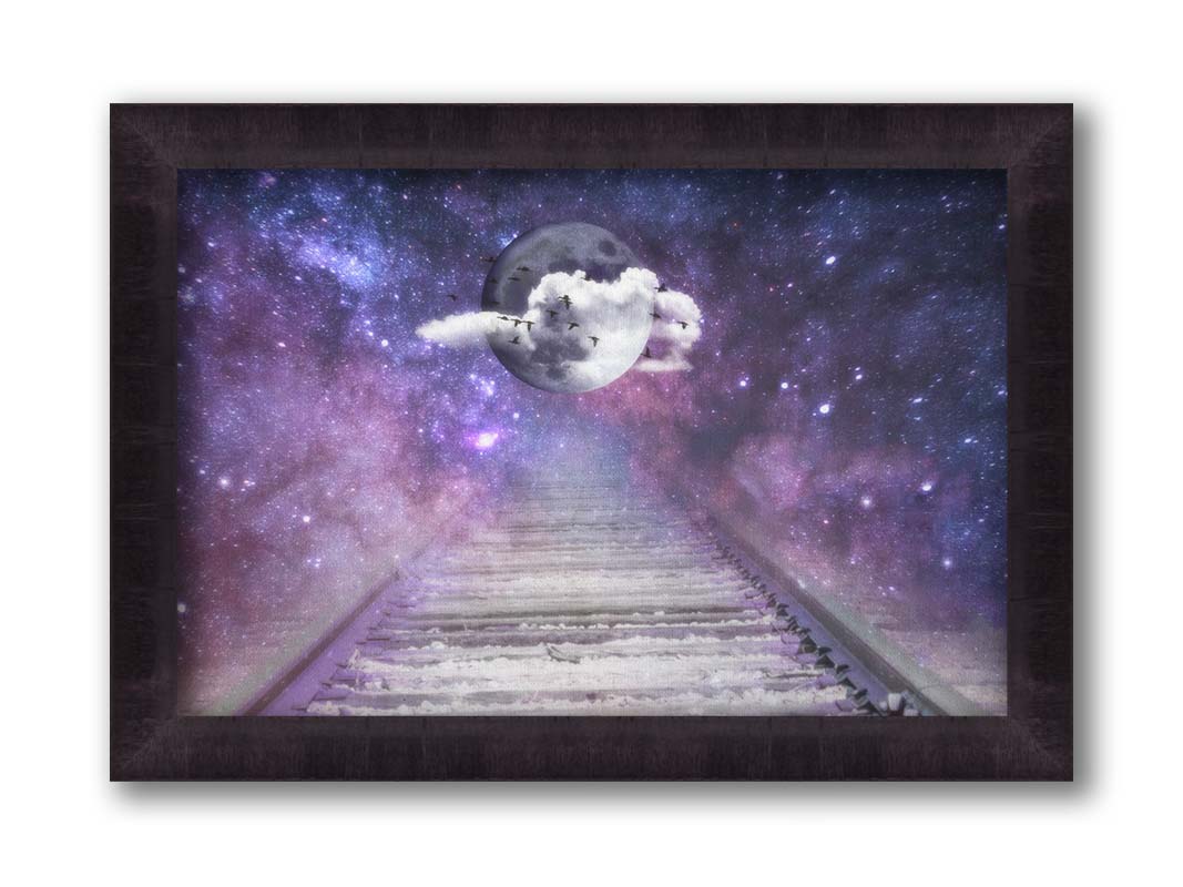 An edited photo looking down train tracks, leading into a starry space view. In the center is a moon surrounded by wispy clouds, with silhouetted geese flying across it. Printed on canvas and framed.