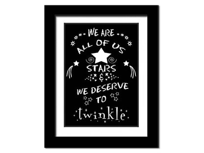 A typography design reading "We are all of us stars and we deserve to twinkle" in white on a black background. Printed on paper, matted, and framed.