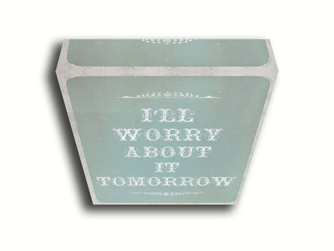 A typography design reading "I'll worry about it tomorrow" in white on a pale blue background. Printed on canvas.