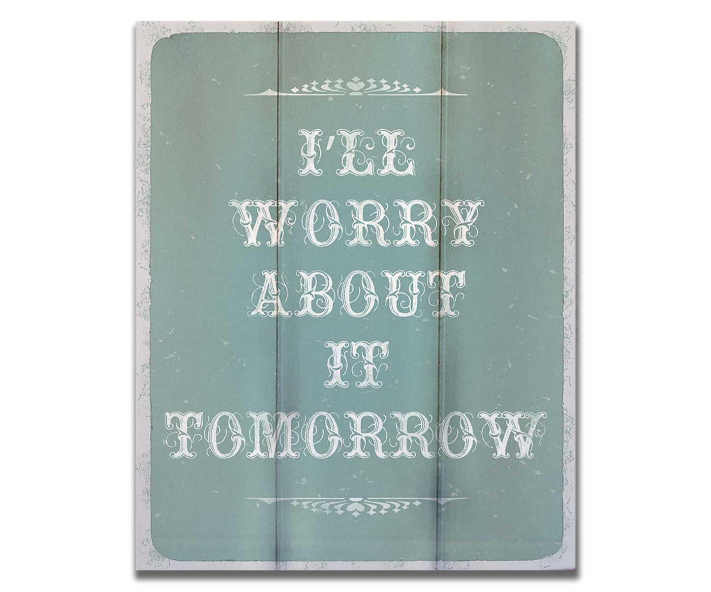 A typography design reading "I'll worry about it tomorrow" in white on a pale blue background. Printed on a box board.