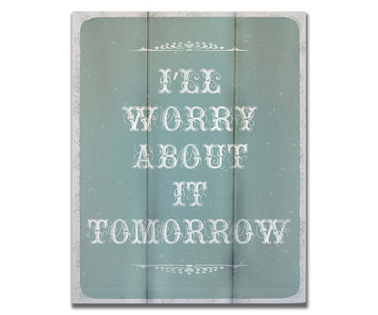 A typography design reading "I'll worry about it tomorrow" in white on a pale blue background. Printed on a box board.