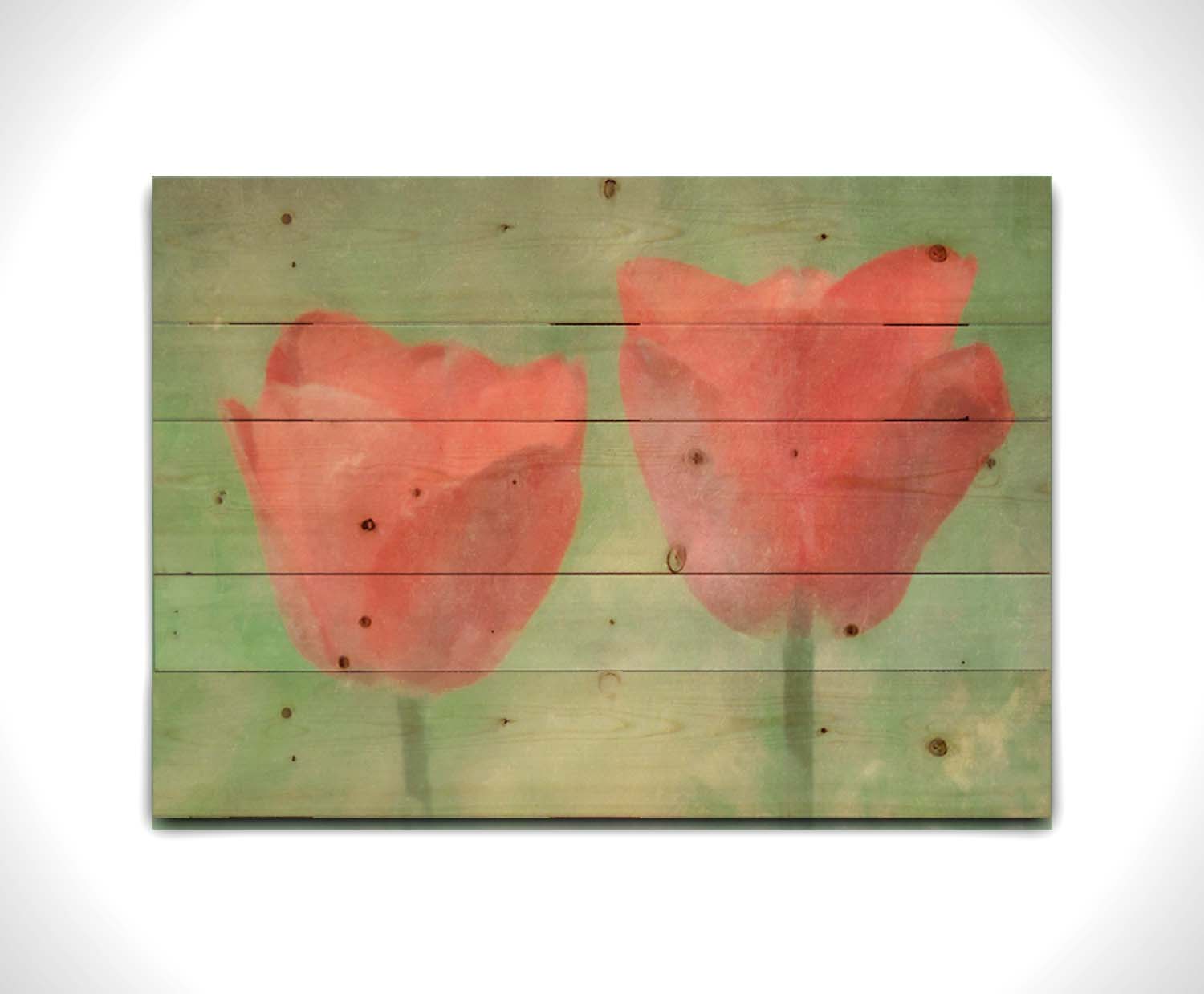 A photo of two red tulips against a green background, edited with dusty worn overlays. Printed on a wood pallet.