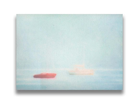 A photo of a small red boat and a small white and yellow boat floating at sea. The photo is edited to have a soft, blurry quality which blends the sky and sea together on the horizon. Printed on canvas.