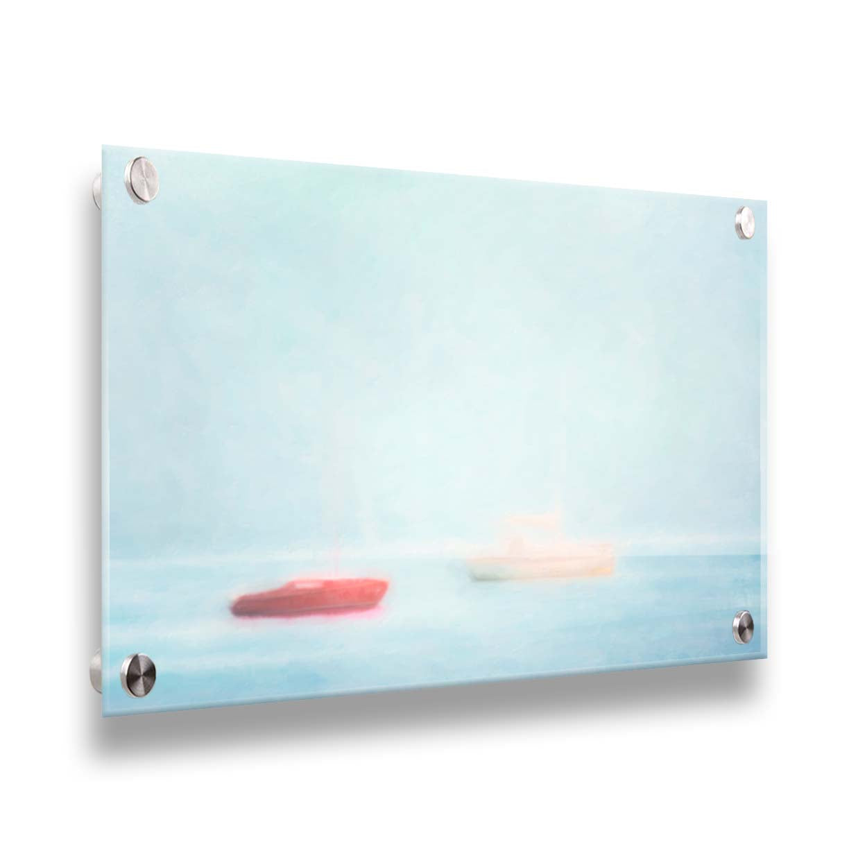 A photo of a small red boat and a small white and yellow boat floating at sea. The photo is edited to have a soft, blurry quality which blends the sky and sea together on the horizon. Printed on acrylic.