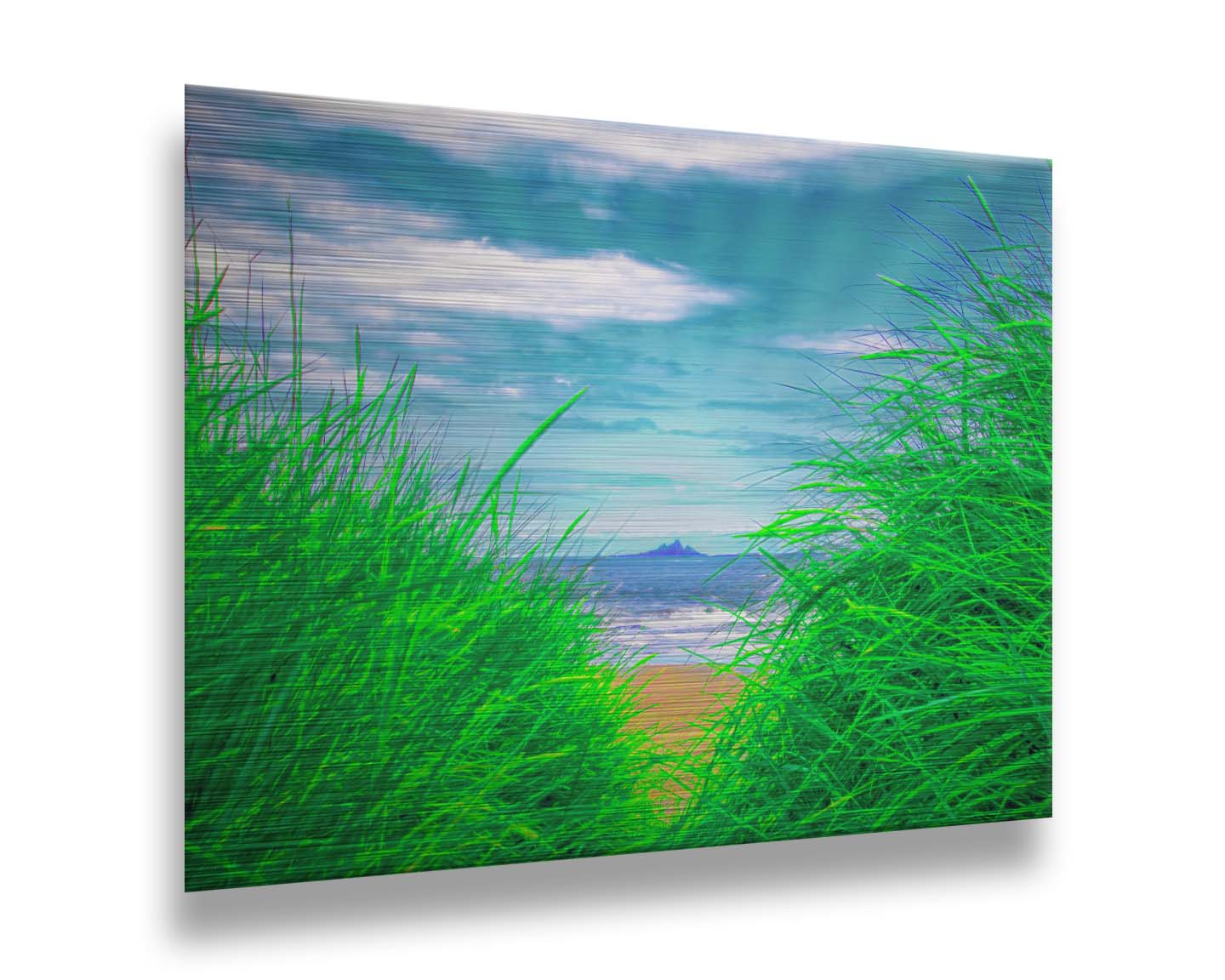 A photograph, edited to increase saturation, looking out at the sea between grassy plants on the beach. A rocky outcropping can be seen in the distance. Printed on metal.