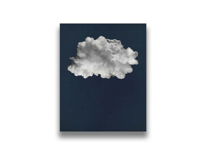 A photo edit of a large, fluffy white cloud against a deep blue background. Printed on canvas.